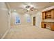 Bright bedroom with ceiling fan, built-in desk, and walk-in closet at 768 Tozzetti Ln, Henderson, NV 89012