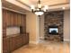 Elegant dining room with built-in cabinetry and stone fireplace at 768 Tozzetti Ln, Henderson, NV 89012