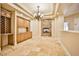 Formal dining room featuring a stone fireplace and built-in cabinetry at 768 Tozzetti Ln, Henderson, NV 89012