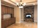 Elegant dining room with built-in cabinetry and stone fireplace at 768 Tozzetti Ln, Henderson, NV 89012