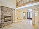 Grand entryway with stone fireplace and elegant tile flooring at 768 Tozzetti Ln, Henderson, NV 89012