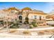 Two-story house with stone exterior and landscaping at 768 Tozzetti Ln, Henderson, NV 89012