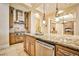 Spacious kitchen island with granite countertops and stainless steel appliances at 768 Tozzetti Ln, Henderson, NV 89012