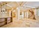 Elegant living room with high ceilings, hardwood floors, and a curved staircase at 768 Tozzetti Ln, Henderson, NV 89012