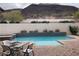 Relaxing backyard pool with a patio and mountain views at 768 Tozzetti Ln, Henderson, NV 89012