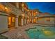 Backyard with a luxurious pool and elegant stonework at 768 Tozzetti Ln, Henderson, NV 89012