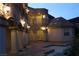 Night view of a house with a pool and courtyard with lighting at 768 Tozzetti Ln, Henderson, NV 89012