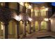 Night view of a house with a pool and courtyard with lighting at 768 Tozzetti Ln, Henderson, NV 89012