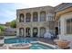 Luxury pool and spa with stone coping and a patio area at 768 Tozzetti Ln, Henderson, NV 89012