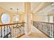 Elegant upper hallway with ornate railing and high ceilings at 768 Tozzetti Ln, Henderson, NV 89012