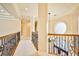 Elegant upper hallway with ornate railing and high ceilings at 768 Tozzetti Ln, Henderson, NV 89012