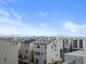 Aerial view of modern townhouses with solar panels and distant city views at 7777 Tempest Sol Ave, Las Vegas, NV 89113