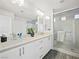 Modern bathroom with double vanity and glass shower at 7777 Tempest Sol Ave, Las Vegas, NV 89113