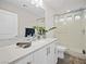 Modern bathroom with white vanity and glass shower at 7777 Tempest Sol Ave, Las Vegas, NV 89113