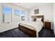 Bedroom with wood bed frame and window at 7777 Tempest Sol Ave, Las Vegas, NV 89113