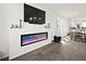 Linear fireplace with modern design and built-in shelving at 7777 Tempest Sol Ave, Las Vegas, NV 89113