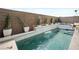 Inviting rectangular pool with spa and a brick wall backdrop at 7777 Tempest Sol Ave, Las Vegas, NV 89113