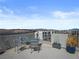 Rooftop deck with seating area, fire pit, and city views at 7777 Tempest Sol Ave, Las Vegas, NV 89113