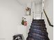 Contemporary staircase, showcasing decorative planter and basket at 7777 Tempest Sol Ave, Las Vegas, NV 89113