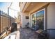 Backyard patio with seating and a view of the fence at 8034 Mercury Skye St, Las Vegas, NV 89166