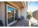 Cozy patio with seating, a grill, and sliding glass doors at 8034 Mercury Skye St, Las Vegas, NV 89166