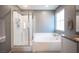 Clean bathroom with shower and bathtub, bright and airy at 8034 Mercury Skye St, Las Vegas, NV 89166