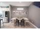 Bright dining area with a concrete table and four metal chairs at 8034 Mercury Skye St, Las Vegas, NV 89166