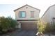 Two-story house with a brown garage door and landscaping at 8034 Mercury Skye St, Las Vegas, NV 89166