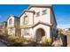 Two-story house with front yard landscaping and a brown door at 8034 Mercury Skye St, Las Vegas, NV 89166