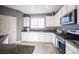 Kitchen with white cabinets, granite countertops, and a window at 8034 Mercury Skye St, Las Vegas, NV 89166