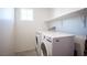 Laundry room with washer and dryer and overhead shelving at 8034 Mercury Skye St, Las Vegas, NV 89166