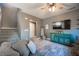 Relaxing living room with sectional sofa and a ceiling fan at 8034 Mercury Skye St, Las Vegas, NV 89166