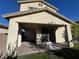 Covered patio with brick pavers, grass, and room for grilling at 8157 Lennox View Ln, Las Vegas, NV 89113