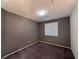 Well-lit bedroom with neutral walls and carpet flooring at 8157 Lennox View Ln, Las Vegas, NV 89113