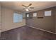 Bedroom with dark gray accent wall and ceiling fan at 8157 Lennox View Ln, Las Vegas, NV 89113