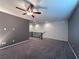 Bright loft with ceiling fan, neutral wall colors, and carpet flooring at 8157 Lennox View Ln, Las Vegas, NV 89113