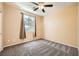 Bedroom with ceiling fan, carpet flooring, and window with blinds at 8477 Orly Ave, Las Vegas, NV 89143