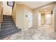 Entryway with staircase, tile floors and access to other rooms at 8477 Orly Ave, Las Vegas, NV 89143