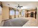 Living room with tile flooring, ceiling fan and kitchen view at 8477 Orly Ave, Las Vegas, NV 89143