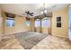 Living room with tile flooring, ceiling fan and large windows at 8477 Orly Ave, Las Vegas, NV 89143