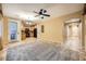 Living room with tile flooring, ceiling fan and kitchen view at 8477 Orly Ave, Las Vegas, NV 89143