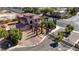 Aerial view of the property showcasing the front yard, garage, and gated entrance at 8490 Via De Bellasidra Ct, Las Vegas, NV 89123