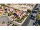 Aerial view of a luxurious home featuring solar panels, and a large yard in a gated community at 8490 Via De Bellasidra Ct, Las Vegas, NV 89123