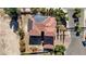 Aerial shot of a home with solar panels, a tile roof, and low-maintenance landscaping at 8490 Via De Bellasidra Ct, Las Vegas, NV 89123