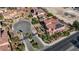 Aerial shot of a gated community with well-manicured landscaping and stunning architecture at 8490 Via De Bellasidra Ct, Las Vegas, NV 89123