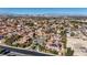 Panoramic aerial view of the Las Vegas Valley showcasing the community and distant mountains at 8490 Via De Bellasidra Ct, Las Vegas, NV 89123