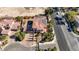 Gorgeous aerial view of landscaped home with solar panels in a well-maintained community at 8490 Via De Bellasidra Ct, Las Vegas, NV 89123