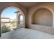 Private balcony featuring stucco walls and iron railing, providing a tranquil outdoor retreat at 8490 Via De Bellasidra Ct, Las Vegas, NV 89123