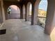 Private balcony with arched entryways and views of the surrounding area at 8490 Via De Bellasidra Ct, Las Vegas, NV 89123