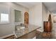 Bar area featuring granite countertops, wood floors and a small sink at 8490 Via De Bellasidra Ct, Las Vegas, NV 89123